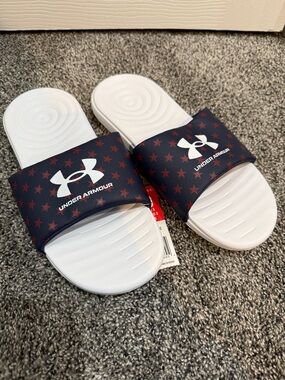 Under Armour women’s Ansa Slide Sandals. Navy with red star graphic. NWT